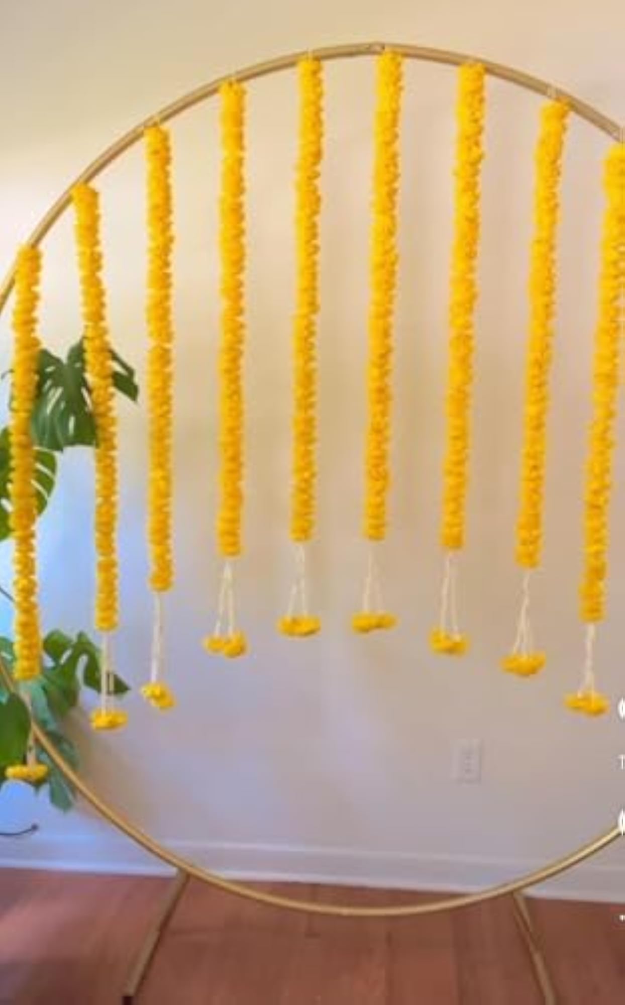 Decorative Ganpati Poojan Setup with Marigold Toran and Umbrellas